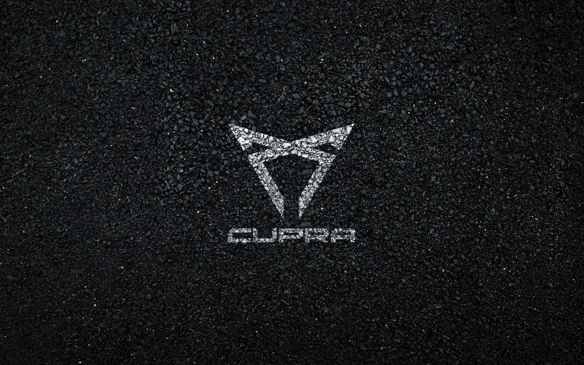 Cupra logo on asphalt texture